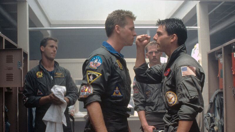 Actors Val Kilmer and Tom Cruise on the set of 1986's Top Gun, directed by Tony Scott.