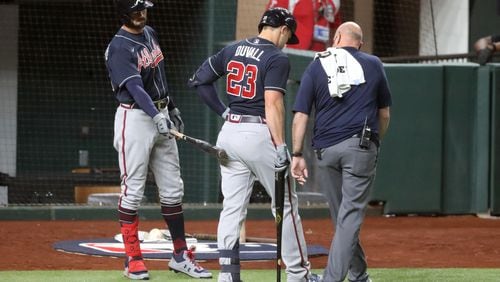 Braves left fielder Adam Duvall (23) leaves the game after getting injured on a swing. (Curtis Compton / Curtis.Compton@ajc.com)