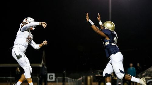 Dacula defensive end Jalen Cole (36) puts pressure on Lanier quarterback Zach Calzada (10), causing an incomplete pass, during the first half of a high school football game between Lanier and Dacula at Dacula High School in Dacula, Ga., on Friday, Oct. 26, 2018. (Casey Sykes for The Atlanta Journal-Constitution)