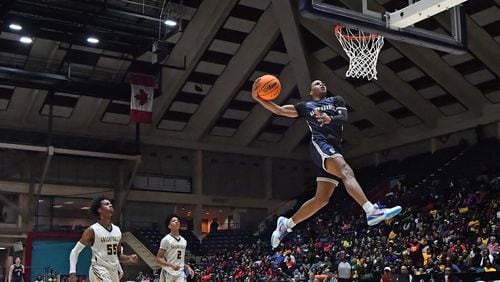 St. Francis' Dwon Odom (1) dunks on a breakaway during the Class A Private championship game against Greenforest Wednesday, March 4, 2020, at the Macon Centreplex in Macon.