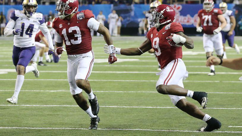 Alabama running back Bo Scarbrough, the offensive player of the game, breaks away for a 68-yard touchdown run for a 24-7 lead over Washington during the fourth quarter in the Chick-fil-A Peach Bowl at the Georgia Dome on Saturday, Dec. 31, 2016, in Atlanta. (Curtis Compton/ccompton@ajc.com)