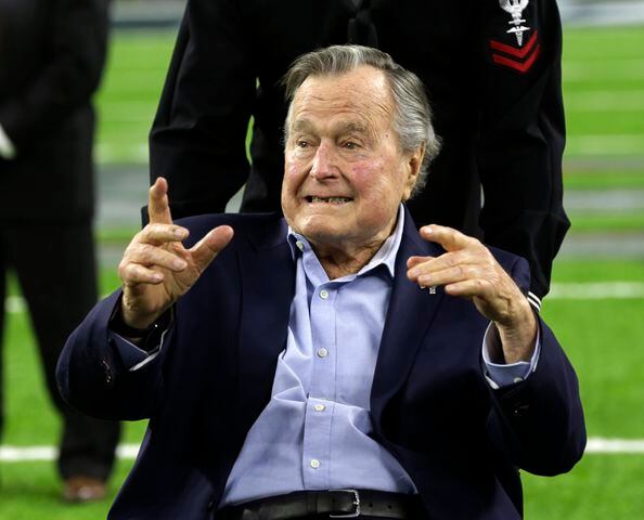 President George H.W. Bush flips coin at Super Bowl