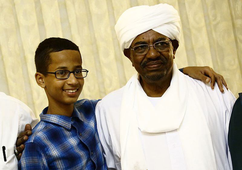 Ahmed Mohamed (L), a 14-year-old US Muslim teenager of Sudanese origin who became an overnight sensation after a Texas teacher mistook his homemade clock for a bomb, poses for a picture with Sudanese President Omar al-Bashir (R) in Khartoum on October 14, 2015. The son of Sudanese immigrants who live in a Dallas suburb, the young robotics fan brought in a home-made clock to impress a new teacher at MacArthur High Schoo was taken away from school in handcuffs and briefly arrested by police. Police later said they have determined that Mohamed had no malicious intent and it was "just a naive set of circumstances." AFP PHOTO / ASHRAF SHAZLY (Photo credit should read ASHRAF SHAZLY/AFP/Getty Images)