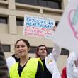 Protesters march on Nov. 12 in front of Atlanta Medical Center, calling for expanded access to Medicaid in Georgia. (Olivia Bowdoin for The Atlanta Journal-Constitution)