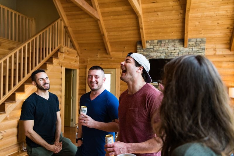 Friends attend a housewarming party for Baron Smith’s and Davis Adams’ lake house in March 2020.