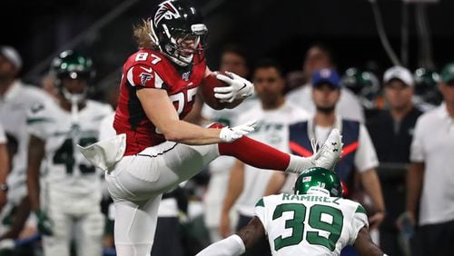 Falcons tight end Jaeden Graham leaps over New York Jets safety Santos Ramirez for a first down during the third quarter in an NFL exhibition game Thursday, August 15, 2019, in Atlanta.   Curtis Compton/ccompton@ajc.com
