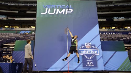 Indiana offensive lineman Jason Spriggs performs the vertical jump test at the NFL football scouting combine in Friday, Feb. 26, 2016, in Indianapolis. (AP Photo/Darron Cummings)
