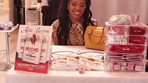 Akia Brown promoting her book "Beyond Love" in Los Angeles. In the book, Brown discusses her nontraditional relationship which resulted in her young children being withdrawn from their Christian school.