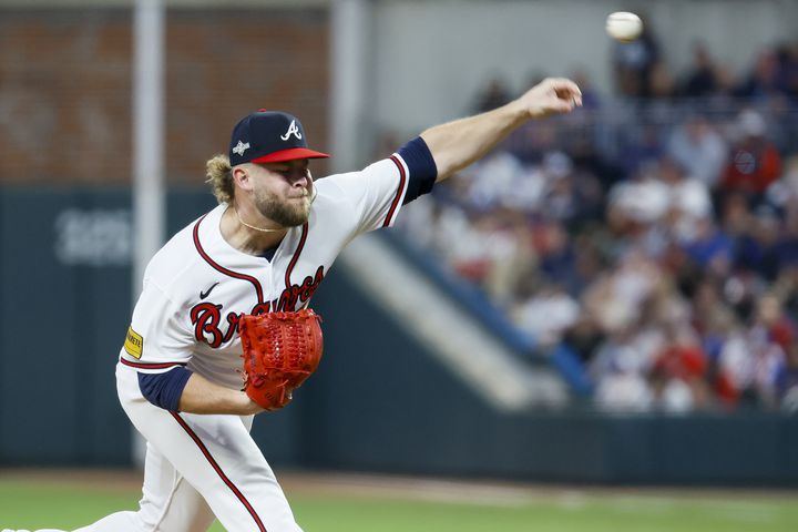 Atlanta Braves relief pitcher A.J. Minter (33) delivers to the Philadelphia Phillies during the eighth inning of NLDS Game 2 in Atlanta on Monday, Oct. 9, 2023.   (Miguel Martinez / Miguel.Martinezjimenez@ajc.com)