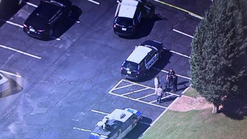 Police are on the scene of a shooting at a hotel on Delk Road in Marietta.