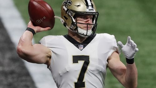 New Orleans Saints quarterback Taysom Hill completes a pass against the Atlanta Falcons during the first quarter on Sunday, Dec. 6, 2020, in Atlanta, Georgia. 
 Curtis Compton / Atlanta Journal-Constitution/TNS