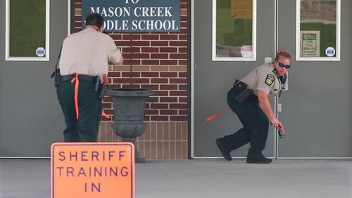 July 25, 2018 Winston: Douglas County Sheriff's deputies are some of the first to arrive during an active shooter training exercise held by the Douglas County Sherriff's Office at Mason Creek Middle School on Wednesday, July 25, 2018, in Winston. The large-scale training drill is meant to test the resources of area law enforcement and emergency responders in an effort to better prepare Douglas County First Responders in the event of a mass casualty active shooter event.   Curtis Compton/ccompton@ajc.com