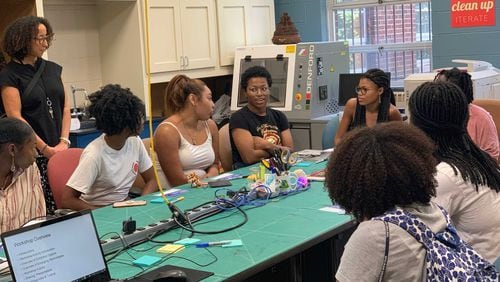 Spelman College students discuss a classroom assignment. The Atlanta college has partnered with, Braven, a nonprofit company, to prepare sophomore students for careers or graduate school. Photo Credit: Spelman College.