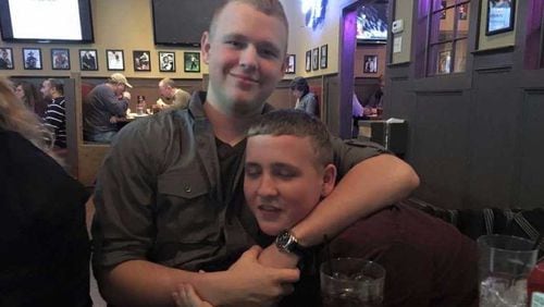 Jack "Deacon" Harris plays around with his younger brother, Garrett. They died together on the drive back from Cobb County to Georgia Southern University on I-16 early the Sunday after Thanksgiving 2017.