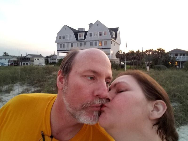 James and Mary Beck of Fayetteville share a kiss on Amelia Island. The couple smells some of the smoke from the Okefenokee wildfire but it isn't enough to spoil their vacation. Photo provided.