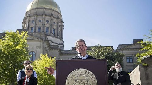Gov. Brian Kemp speaks during a press conference at Liberty Plaza, across the street from the Georgia State Capitol building, in downtown Atlanta, Wednesday, April 1, 2020. During the presser, Kemp ordered all Georgia K-12 schools to be closed until the end of the academic school year and said he will sign an order enforcing a “stay-at-home” order for all Georgians until April 13.