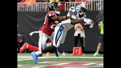 Carolina Panthers wide receiver DJ Moore (12) runs against Atlanta Falcons defensive back Jordan Richards (29) during the second half of an NFL football game, Sunday, Sept. 16, 2018, in Atlanta. Moore scored a touchdown on the play. The Atlanta Falcons won 31-24. (AP Photo/John Bazemore)
