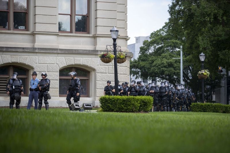Police officers dressed in riot gear are stationed in front of the Capitol building during the fourth day of protests in Atlanta on Monday, June 1, 2020. (Photo: ALYSSA POINTER / ALYSSA.POINTER@AJC.COM)