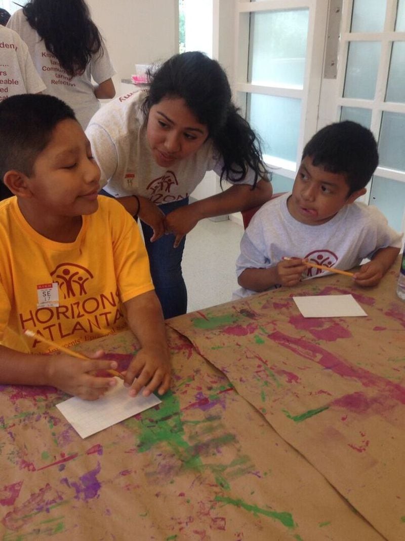 Suleima Millan-Salinas (center) assists Horizons Atlanta students during a field trip last summer to the High Museum of Art. Millan-Salinas, now a student at Berry College in Rome, said the program changed her life. CONTRIBUTED