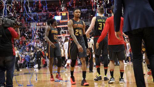 Atlanta Hawks forward Kent Bazemore (24) and forward Taurean Prince (12) walk off the court after Game 2 of the team’s first-round NBA basketball playoff series against the Washington Wizards, Wednesday, April 19, 2017, in Washington. The Wizards won 109-101. (AP Photo/Nick Wass)