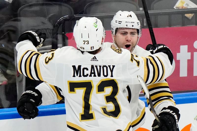 Boston Bruins' Jake DeBrusk (74) celebrates his goal against the Toronto Maple Leafs with Charlie McAvoy (73) during the third period of action in Game 3 of an NHL hockey Stanley Cup first-round playoff series in Toronto on Wednesday, April 24, 2024. (Frank Gunn/The Canadian Press via AP)