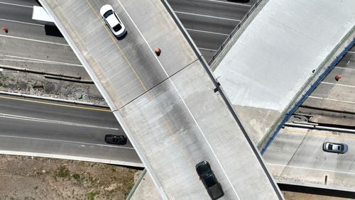 This aerial photo shows construction of the I-285 interchange at Ga. 400 in Sandy Springs in May. The state plans to open new westbound I-285 exit lanes to Ga. 400 on Monday. (Hyosub Shin / Hyosub.Shin@ajc.com)