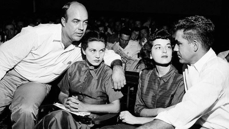 In this Sept. 23, 1955, file photo. Carolyn Bryant Donham (2nd from right) sits with her husband Roy Bryant (far right), along with J.W. Milam (left), and his wife in a courtroom in Sumner, Miss. Milam and Bryant were acquitted of murder in the slaying of Emmett Till.