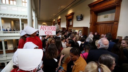 People fill the hallways outside a Georgia Legislature committee room protesting against House Bill 481, the “heartbeat bill” that would outlaw most abortions at about six weeks into a pregnancy. (JASON GETZ/SPECIAL TO THE AJC)