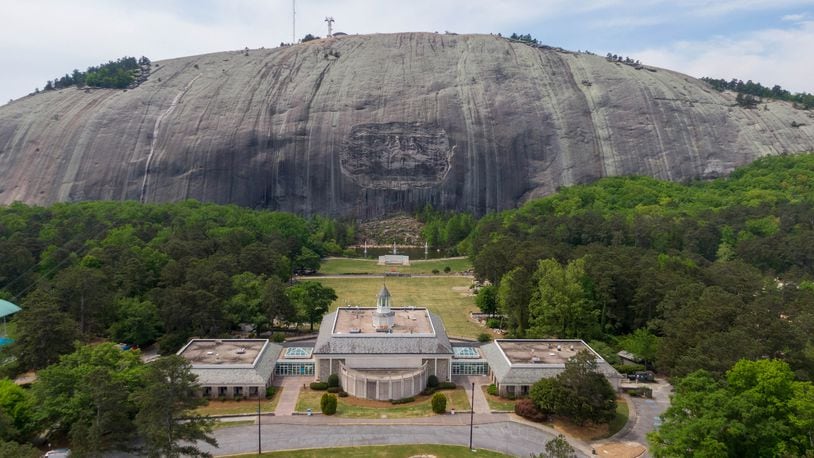 April 20, 2021 Stone Mountain - Aerial photograph shows Memorial Hall (foreground) and Confederate Memorial Carving (background) at Stone Mountain Park on Tuesday, April 20, 2021. (Hyosub Shin / Hyosub.Shin@ajc.com)