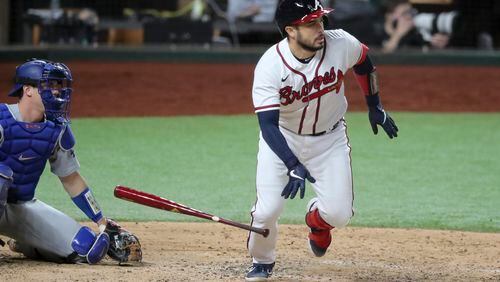 10/16/20 - Arlington - Atlanta Braves catcher Travis d'Arnaud (16) singles in the third inning in Game 5 Friday, Oct. 16, 2020, for the best-of-seven National League Championship Series at Globe Life Field in Arlington, Texas..  (Curtis Compton / Curtis.Compton@ajc.com)  