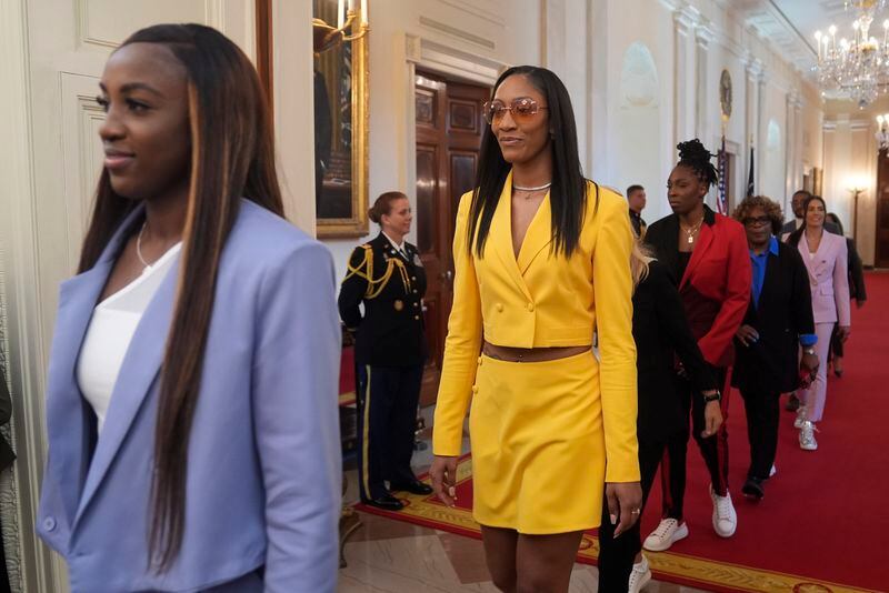 A'ja Wilson, of the 2023 WNBA champion Las Vegas Aces, second from left, arrives at an event with President Joe Biden and Vice President Kamala Harris to celebrate the team in the East Room of the White House, Thursday, May 9, 2024, in Washington. (AP Photo/Evan Vucci)
