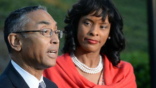 DeKalb CEO Burrell Ellis, with his wife Philippa, speaks during a press conference Thursday for the first time since he was convicted a year and a half ago following a second trial in DeKalb County. The Georgia Supreme Court threw out Ellis’ guilty verdicts on Wednesday. KENT D. JOHNSON/kdjohnson@ajc.com