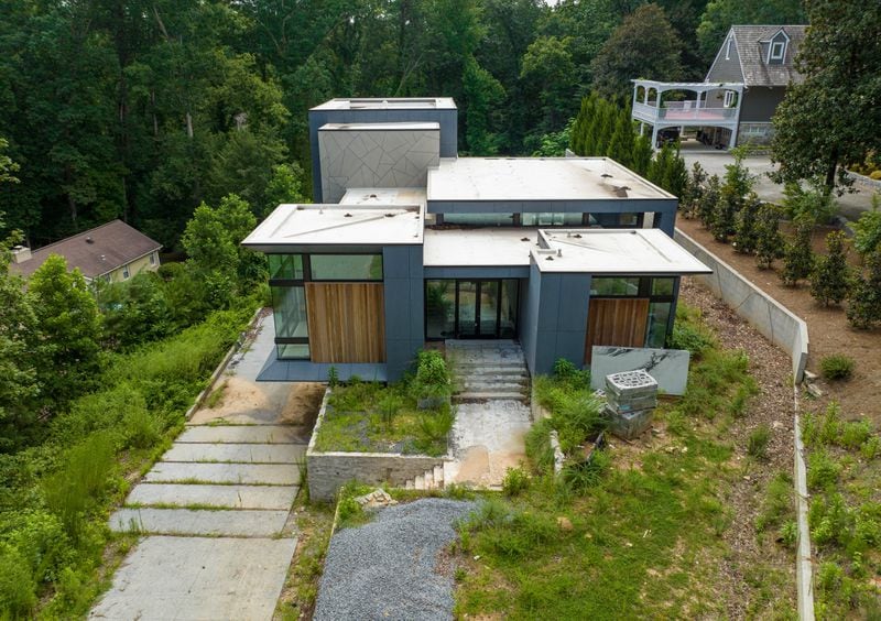 Michael Zembillas, who was constructing this home on Randall Mill Road in Buckhead, agreed to sell it to a man he believed was named "Archie Lee" for $4.4 million in 2020. The unfinished home is now subject to forfeiture and sale by the government. Federal agents searched the house for the missing gold coins but didn't find any. (Hyosub Shin / Hyosub.Shin@ajc.com)