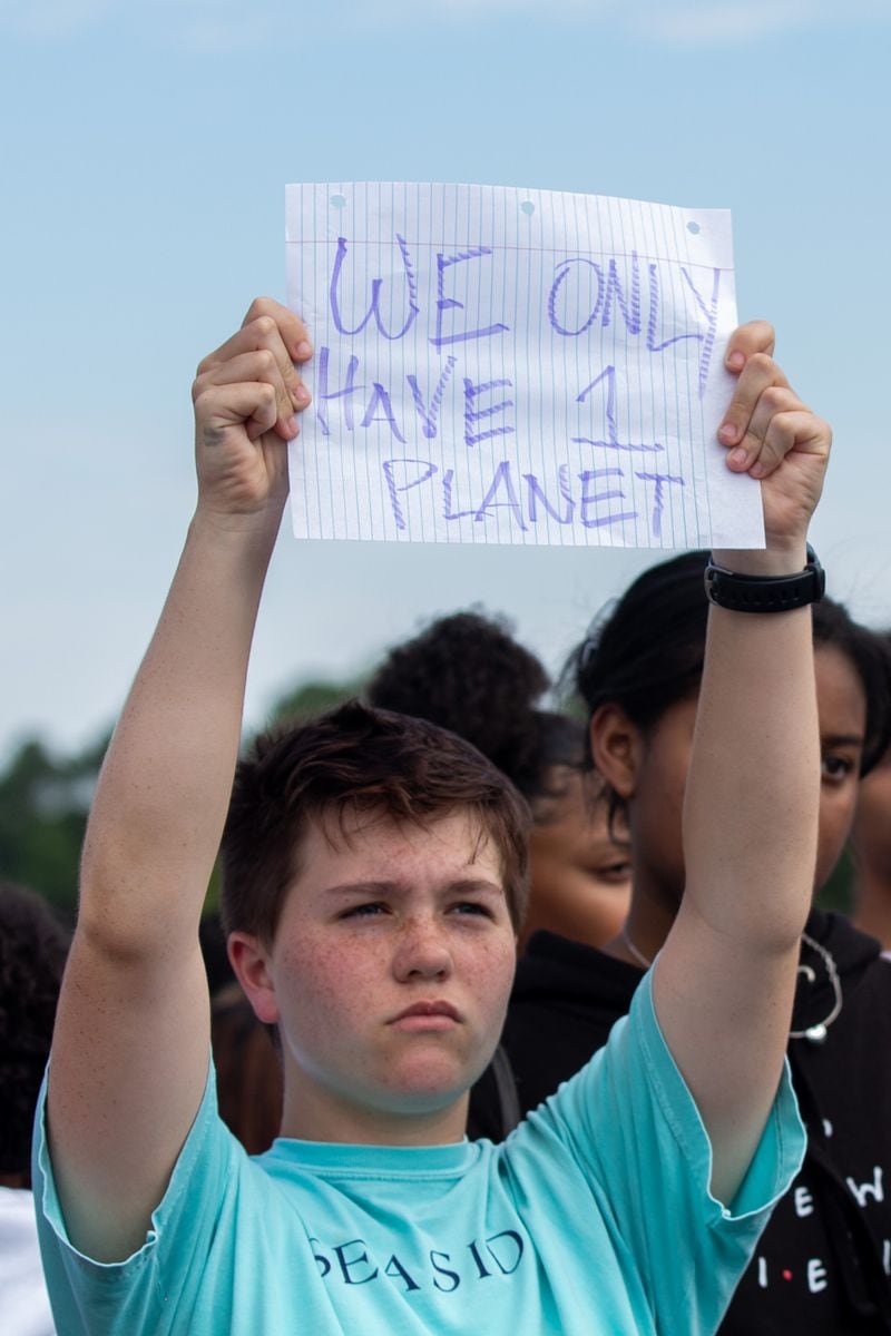 Bella Rocchio, sophomore at North Atlanta High School, holds up a sign during an organized school-wide climate walkout on Thursday, Sept. 26, 2019, in Atlanta, Georgia. (Photo/Rebecca Wright for the Atlanta Journal Constitution)