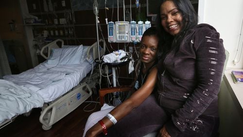 Tammika “Niki” Glass, 37, left, and Karen Tompkins, 52, photographed Monday, Jan. 26, 2015, became “heart sisters” at Northwestern Medical Center in Chicago, Ill., where they both waited for heart transplants. Contributed by Nancy Stone/Chicago Tribune/TNS