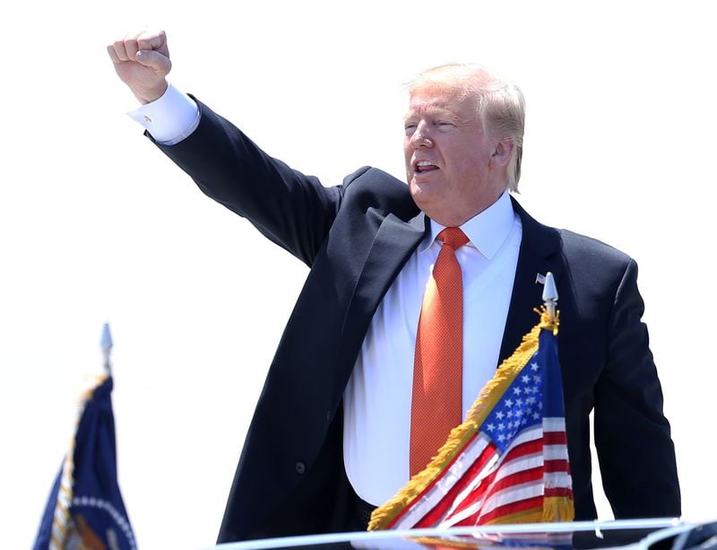  President Donald Trump yells to the crowd who was there to greet him at Hartsfield-Jackson Airport in Atlanta on Wednesday. For Trump's first visit to Georgia in 2019, he  headlined the Rx Drug Abuse and Heroin Summit in Atlanta focusing on prescription drug abuse.  EMILY HANEY / emily.haney@ajc.com
