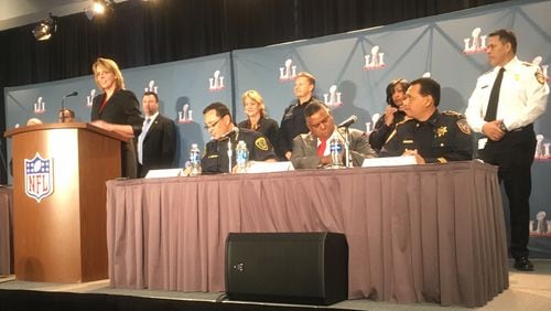 NFL security chief Cathy Lanier, standing, was joined by local and federal authorities including Houston Police Chief Art Acevedo, seated from left, Perrye K. Turner special agent in charge of the FBI s Houston Division and Harris County Sheriff Ed Gonzalez. Photo: Jennifer Brett
