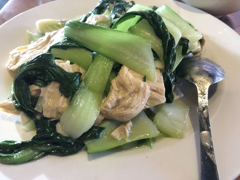 The stir-fried bok choy with tofu skin at Hai Authentic Chinese in Decatur is a nice contrast to the hot dishes. CONTRIBUTED BY WENDELL BROCK
