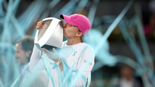 Poland's Iga Swiatek kisses the trophy after winning the women's final match against Aryna Sabalenka of Belarus, at the Mutua Madrid Open tennis tournament in Madrid, Spain, Saturday, May 4, 2024. (AP Photo/Bernat Armangue)
