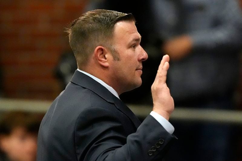 Daryl Reed, a member of the U.S. Army Reserves, is sworn in before giving testimony Thursday, April 25, 2024, in Augusta, Maine, during a hearing of the independent commission investigating the law enforcement response to the mass shooting in Lewiston, Maine. (AP Photo/Robert F. Bukaty)