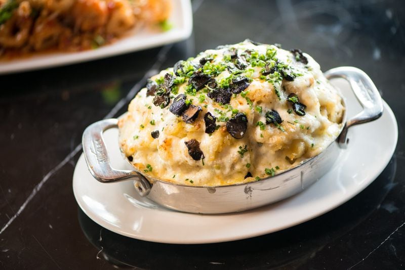 Uptown Del's Potato side with melted Fontina, chives, and shaved truffle. Photo credit- Mia Yakel.