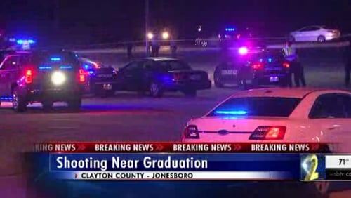 A shooting near a high school graduation killed one woman and injured another, police said.