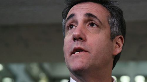 Michael Cohen, former attorney and fixer for President Donald Trump, speaks to the press at the Hart Senate Office Building after testifying to the Senate Intelligence Committee on Capitol Hill on Tuesday. Last year Cohen was sentenced to three years in prison and ordered to pay a $50,000 fine for tax evasion, making false statements to a financial institution, unlawful excessive campaign contributions and lying to Congress as part of special counsel Robert Mueller's investigation into Russian meddling in the 2016 presidential elections. Mark Wilson/Getty Images