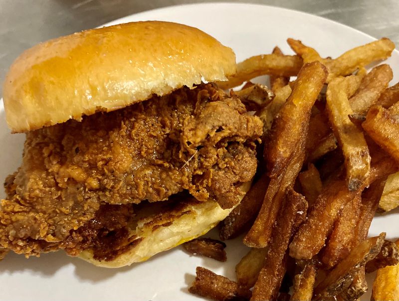 Argosy in East Atlanta Village does hot chicken right. This sandwich is made with a chicken thigh, fried to perfection, then doused with ghost honey. 
Wendell Brock for The Atlanta Journal-Constitution