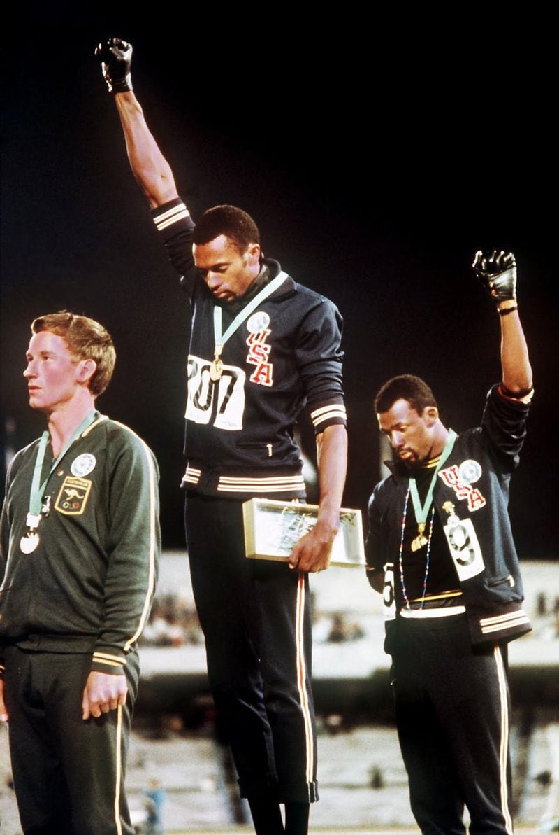 “With Drawn Arms: Glenn Kaino and Tommie Smith” at the High Museum focuses on the influence of sprinter Smith’s (center) raised arm gesture at the 1968 Summer Olympic Games to protest human rights abuses, a gesture that has inspired other expressions of protest. © TIME & LIFE PICTURES / GETTY IMAGES