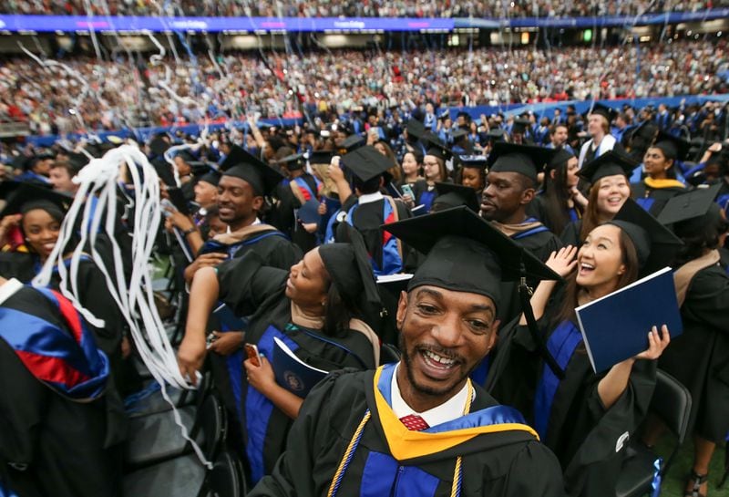 Georgia State graduates celebrate during the Spring Commencement at the Georgia Dome in this AJC file photo. BRANDEN CAMP/SPECIAL