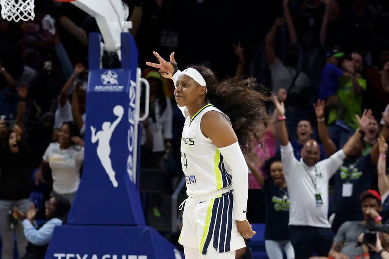Dallas Wings guard Arike Ogunbowale (24) celebrates her winning three-point shot against the Indiana Fever during the second half of an WNBA basketball game in Arlington, Texas, Friday, May 3, 2024. (AP Photo/Michael Ainsworth)