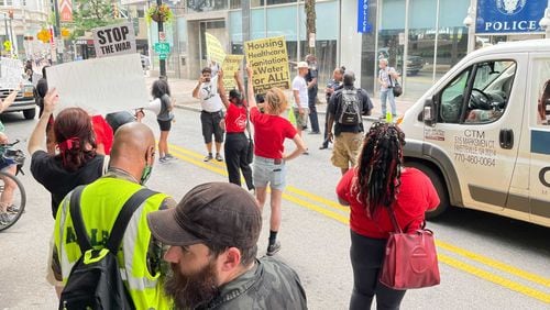 Activists gathered for a protest downtown Tuesday to urge the city to provide better services for its homeless population. (Anjali Huynh/AJC)