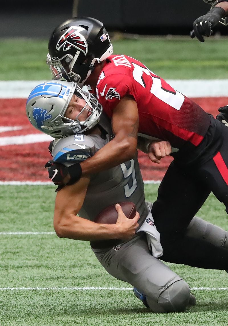 Falcons cornerback A.J. Terrell sacks Detroit Lions quarterback Matthew Stafford but is flagged for a roughing-the-passer penalty, setting up a Detroit touchdown during the first quarter Sunday, Oct. 25, 2020, Mercedes-Benz Stadium in Atlanta. (Curtis Compton / Curtis.Compton@ajc.com)