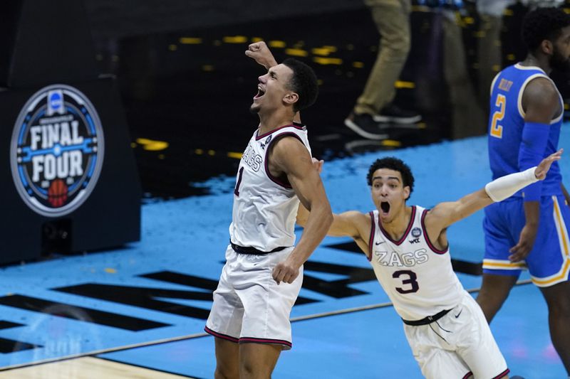 Gonzaga guard Jalen Suggs (1) celebrates making the game winning basket against UCLA during overtime in a men's Final Four NCAA college basketball tournament semifinal game, Saturday, April 3, 2021, at Lucas Oil Stadium in Indianapolis. Gonzaga won 93-90. (AP Photo/Darron Cummings)